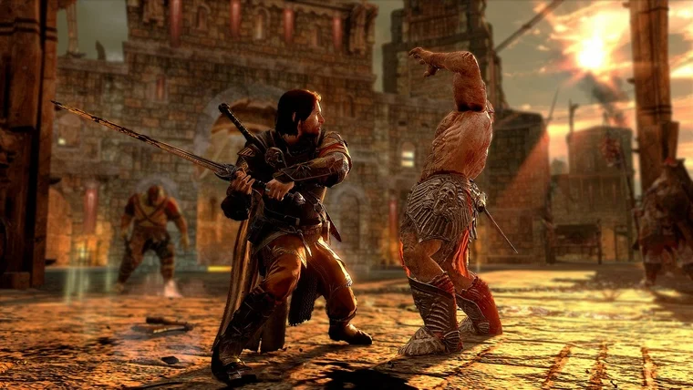 Talion egy ork kapitánnyal harcol a naplementében egy mordori erőd udvarán a Nemesis rendszer részeként